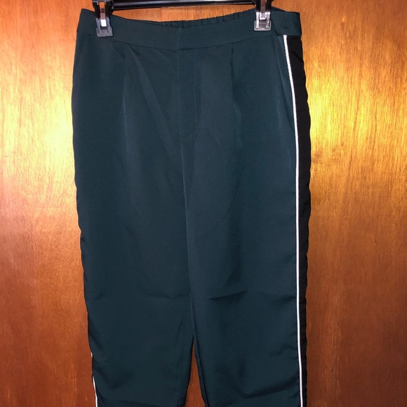 black pants with green side stripe